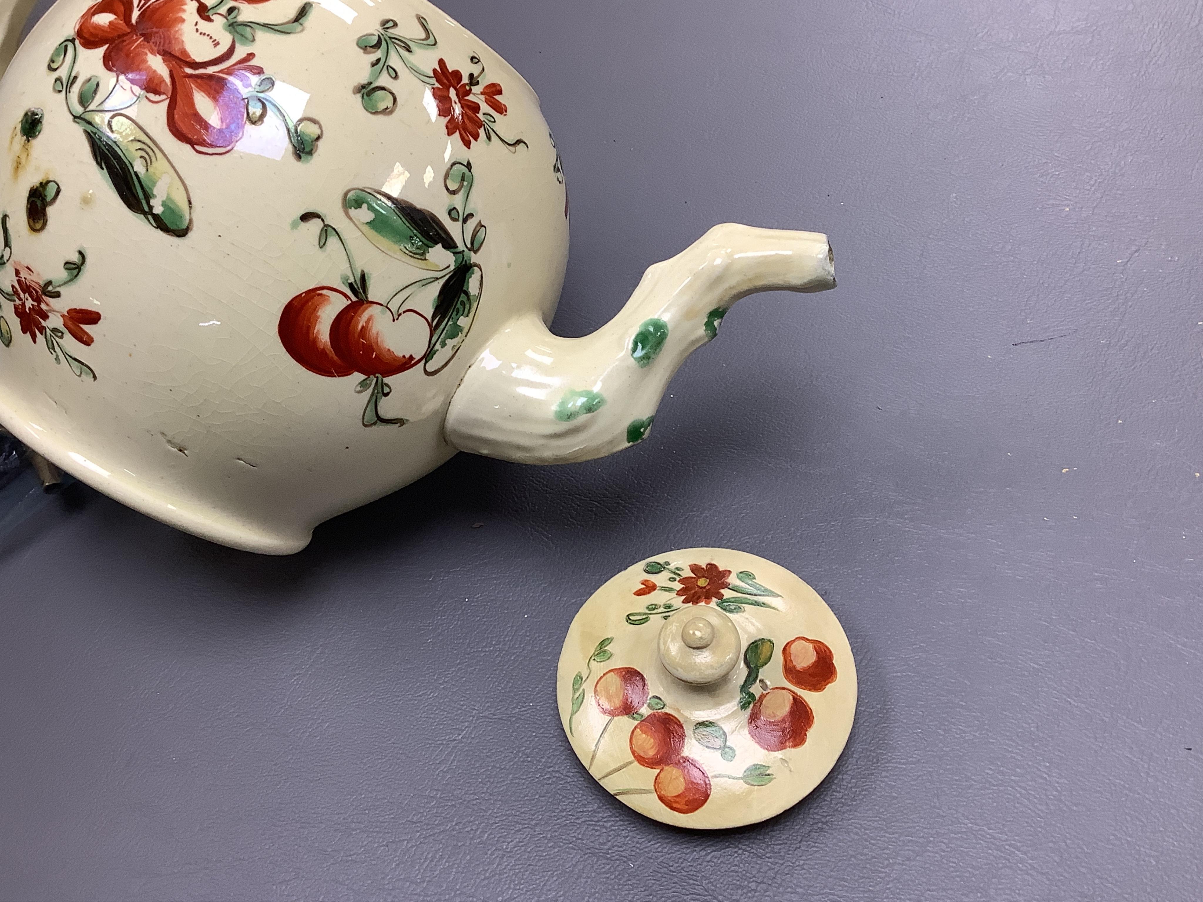 Two George III creamware teapots and a lidded sugar bowl, c.1780, largest 20cm wide